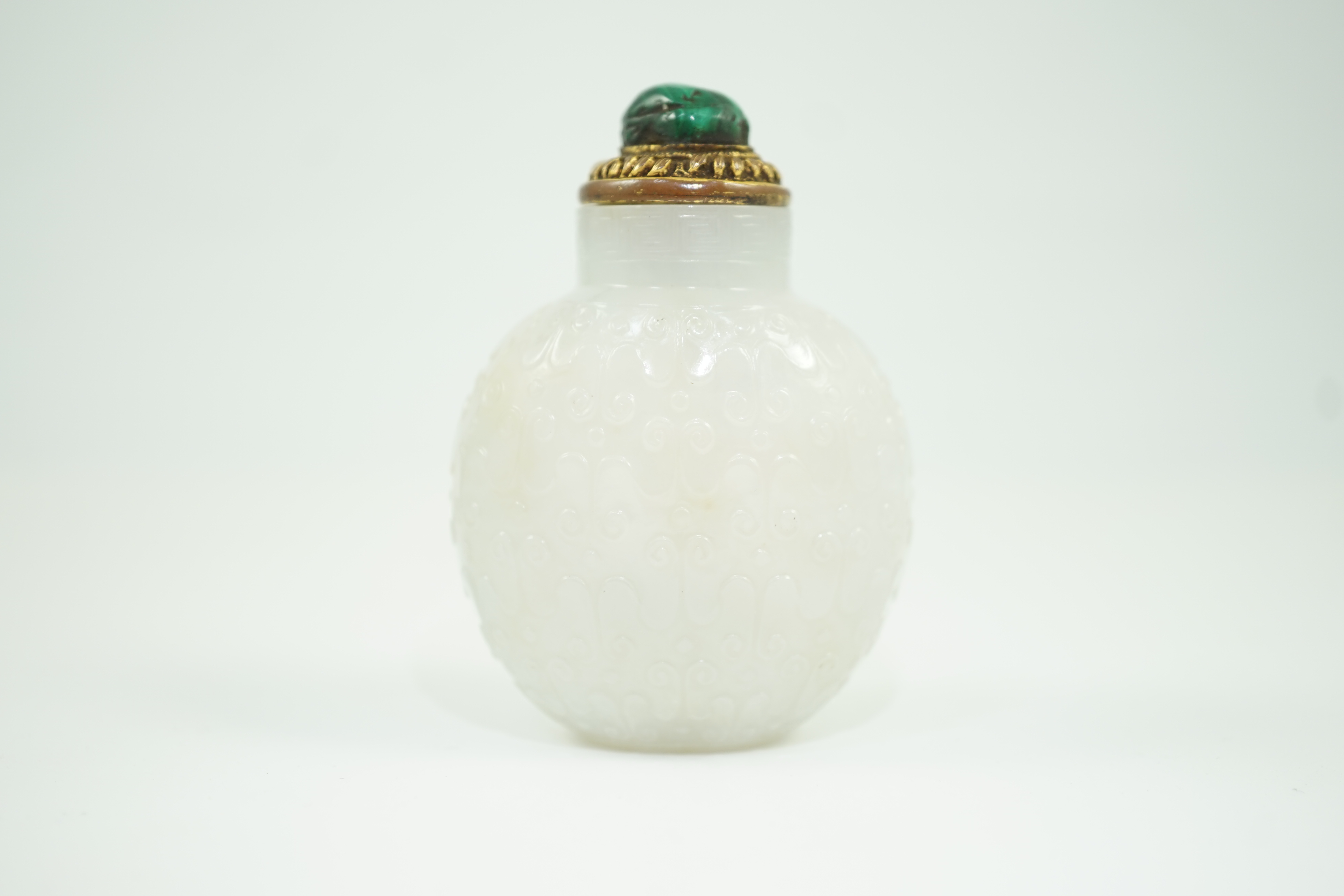 A good Chinese archaistic white jade snuff bottle, 1780-1850